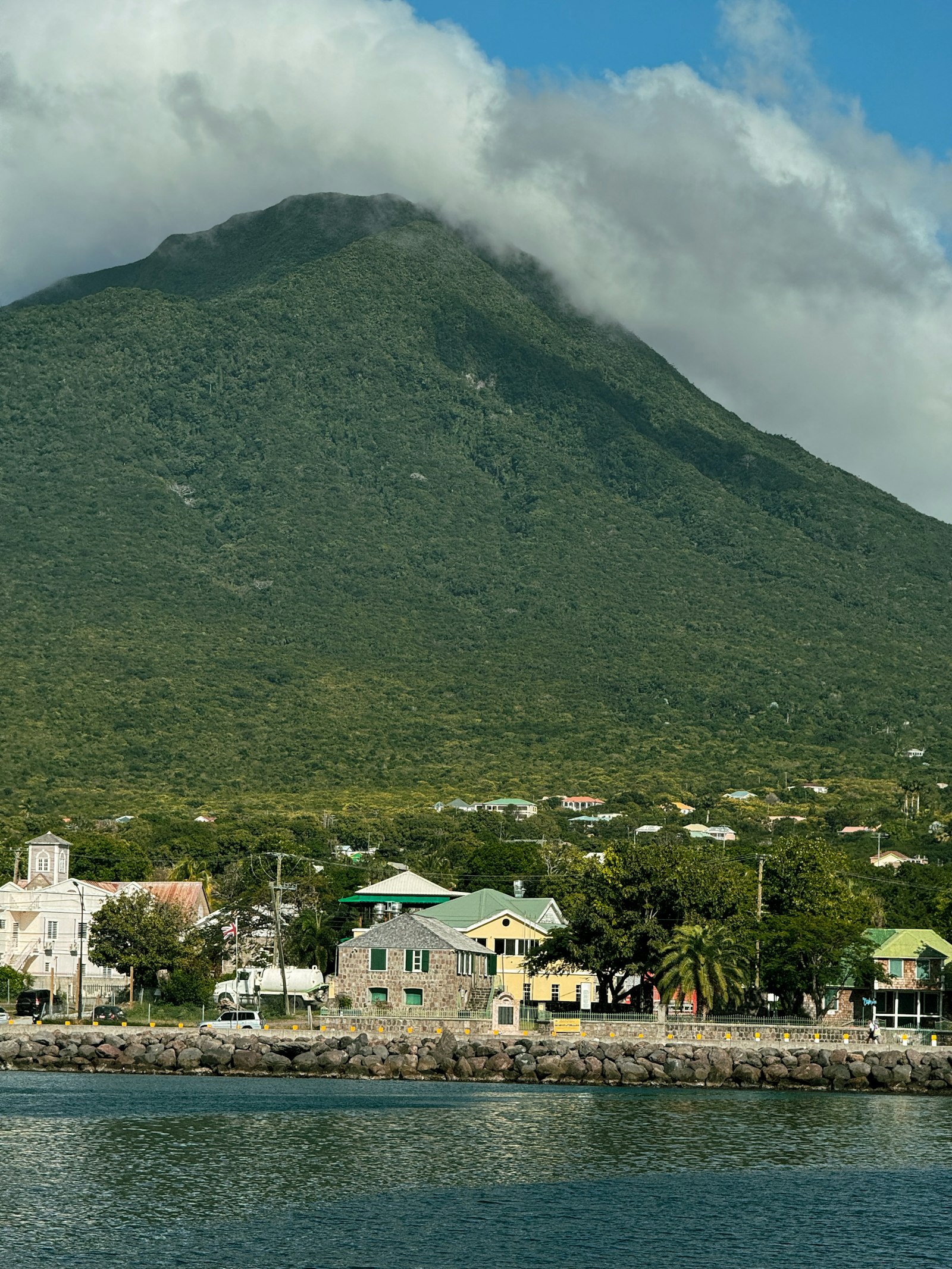 The waterfront and buildings of Charlestown, Nevis, with the mountain behind